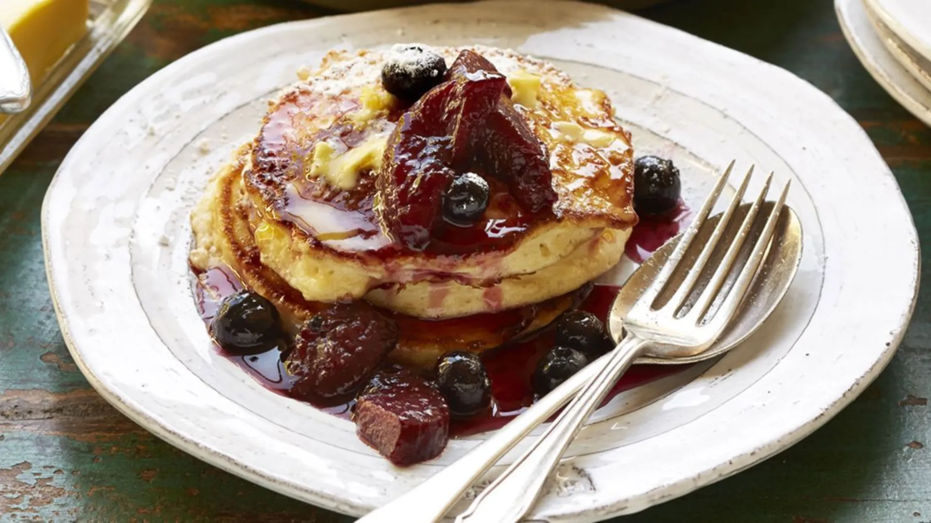 Ricotta hotcakes with blueberry-plum syrup