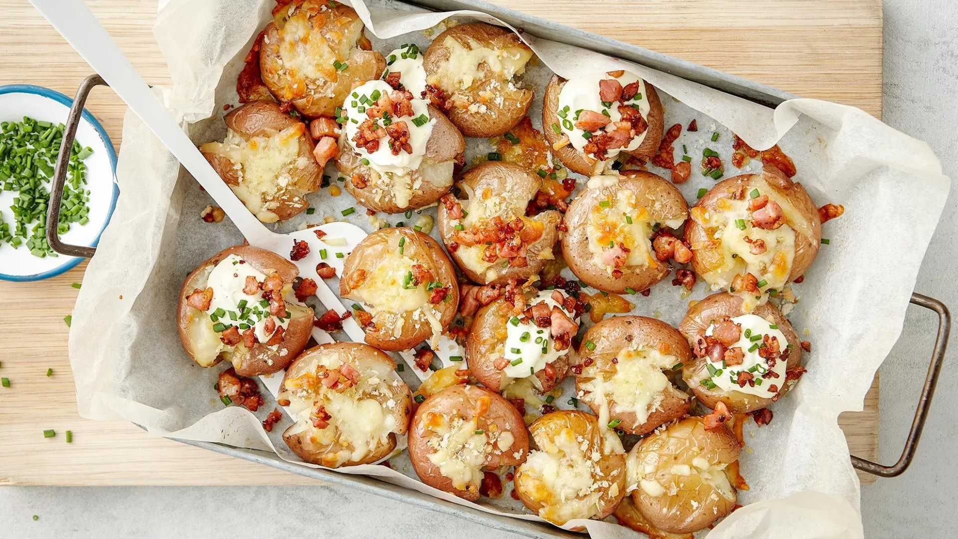 Crispiest-ever smashed potatoes with cheese and bacon crumb